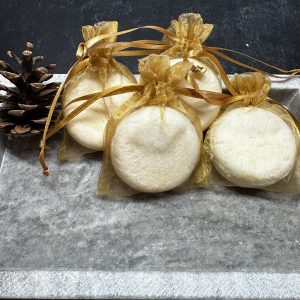 Shampoo Bar by dash of nature displayed with 4 products and one pinecone in a stone tray